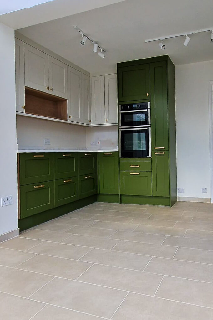 Kitchen fitter measuring up in West Sutton before Howdens installation